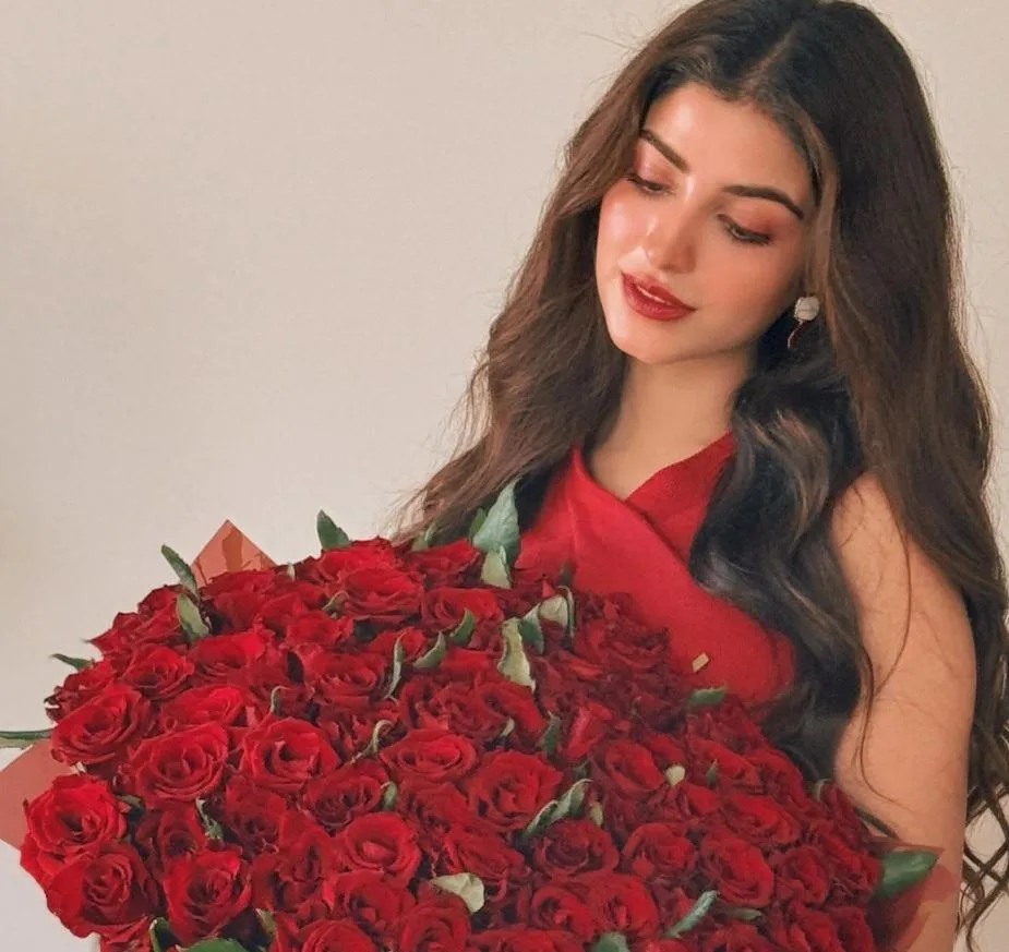 Kinza Hashmi pic in red dress holding red roses, Behind the Scenes: Kinza Hashmi's First Drama Salary Exposed! 